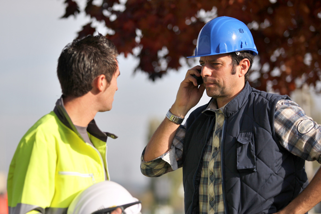 Occupational Safety Construction worker on phone