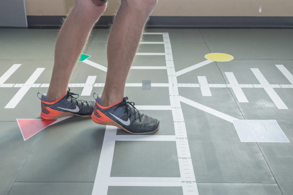 patient doing rehab exercises on smartcells physical therapy mat