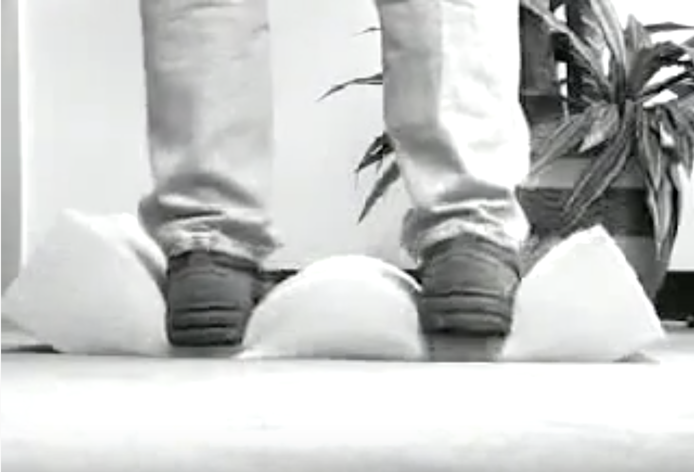 Soft Cushion man standing on piece of foam