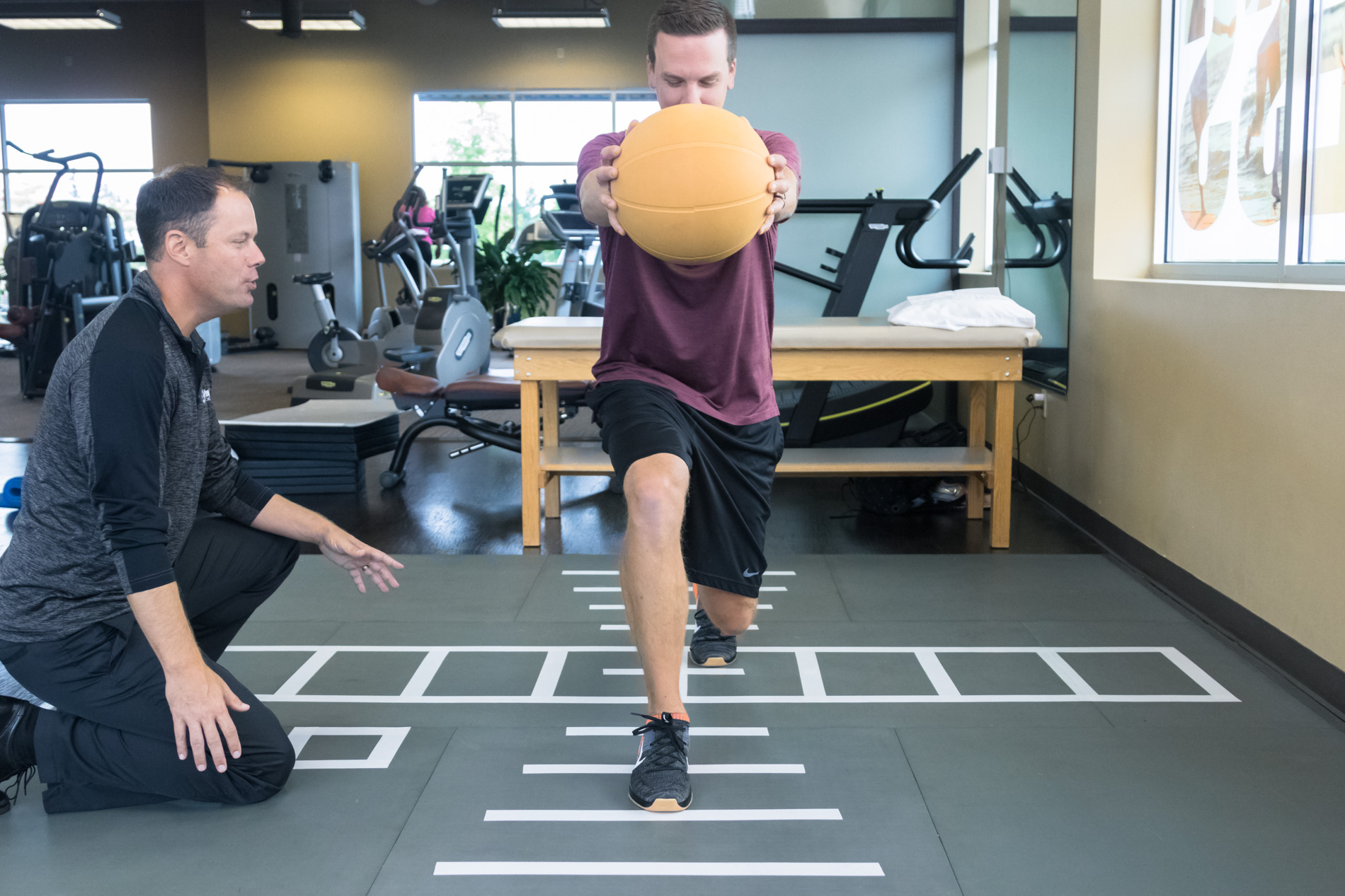 Patient doing rehab exercises on SmartCells physical therapy mat