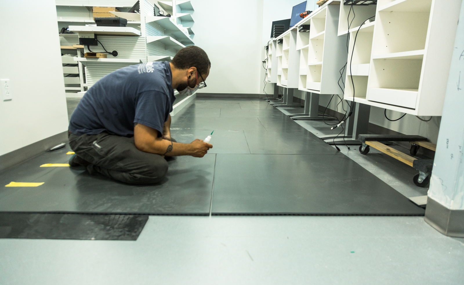 Older worker sitting in manufacturing environment