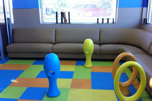 Playground Peace of Mind Older worker sitting in manufacturing environment