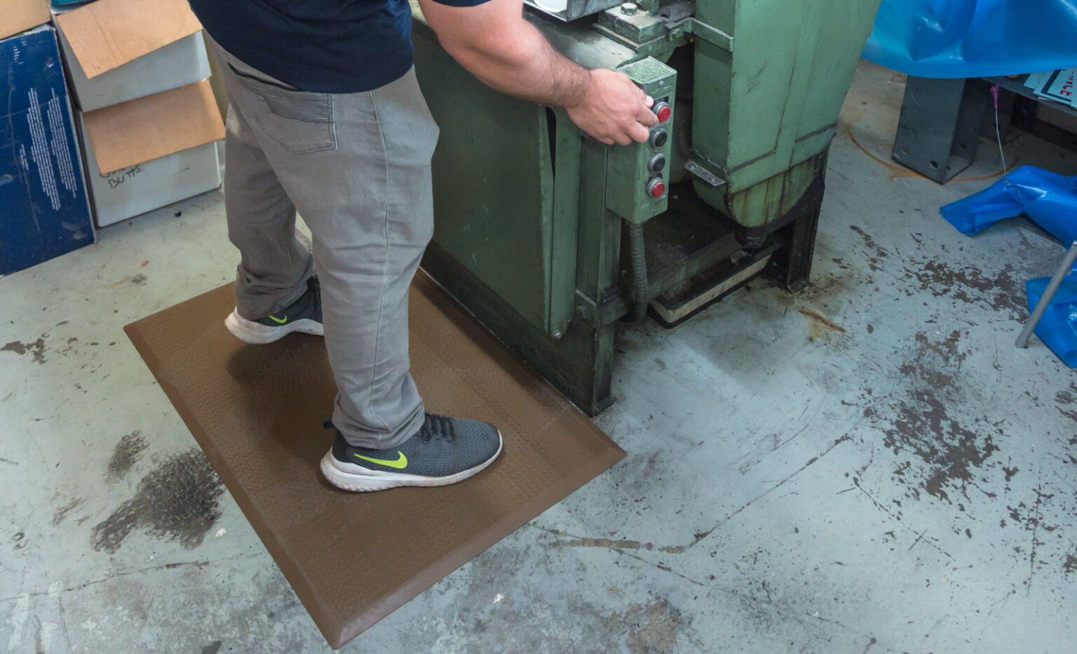 Older worker sitting in manufacturing environment