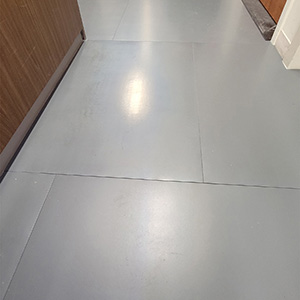 Poly Finish low Older worker sitting in manufacturing environment