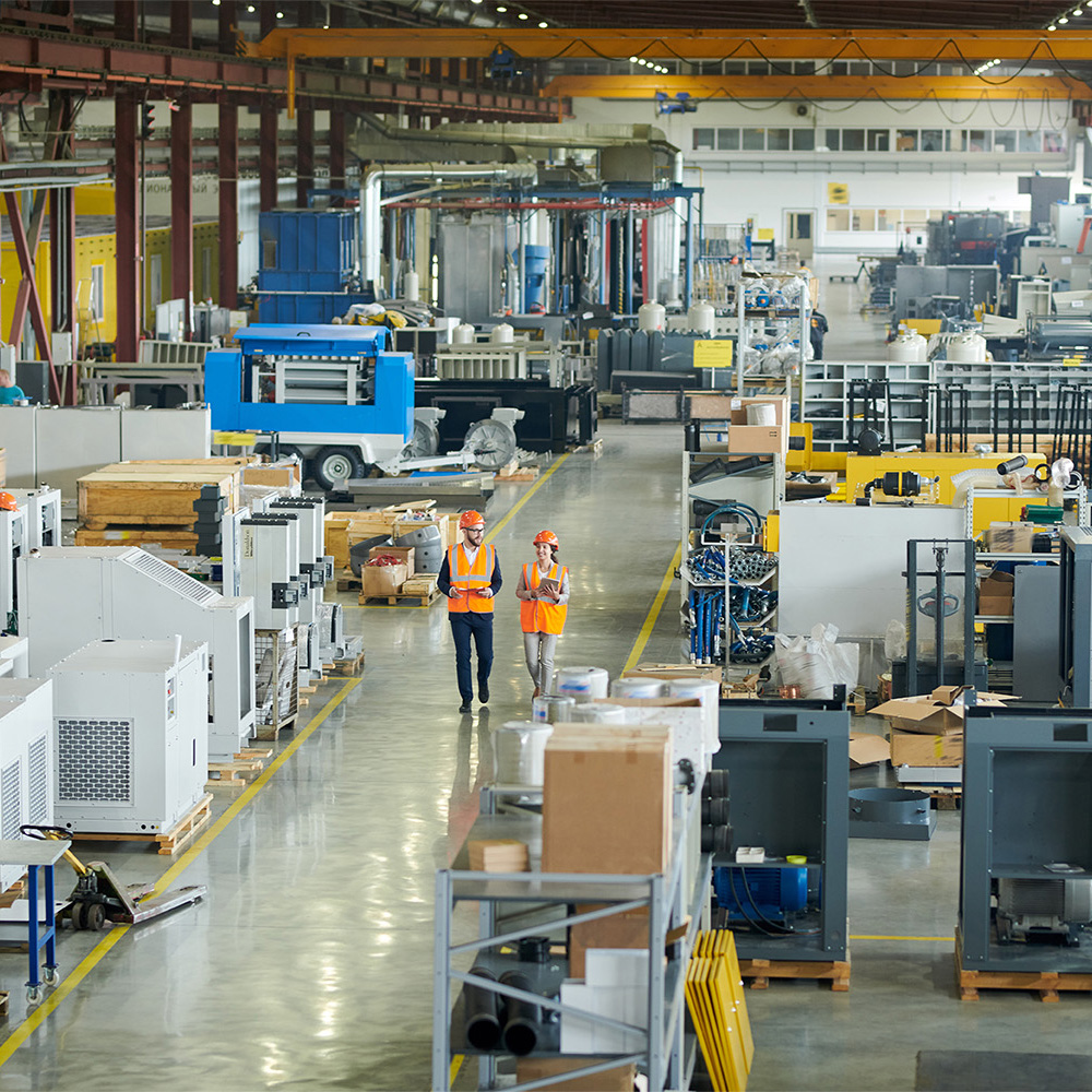 Older worker sitting in manufacturing environment