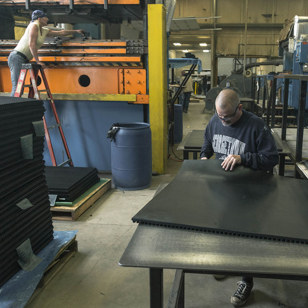 Older worker sitting in manufacturing environment