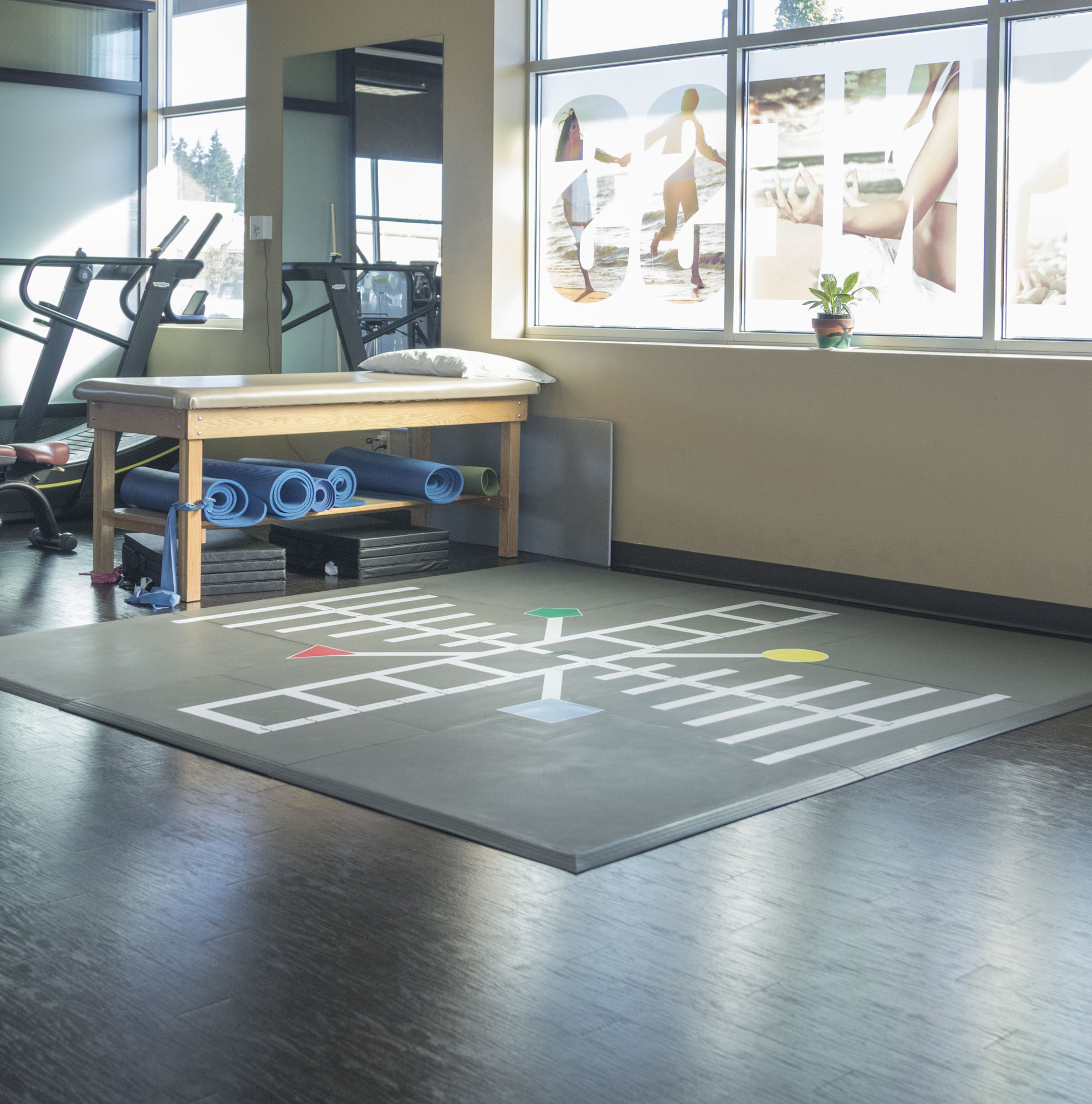 SmartCells Physical Therapy Mat Older worker sitting in manufacturing environment