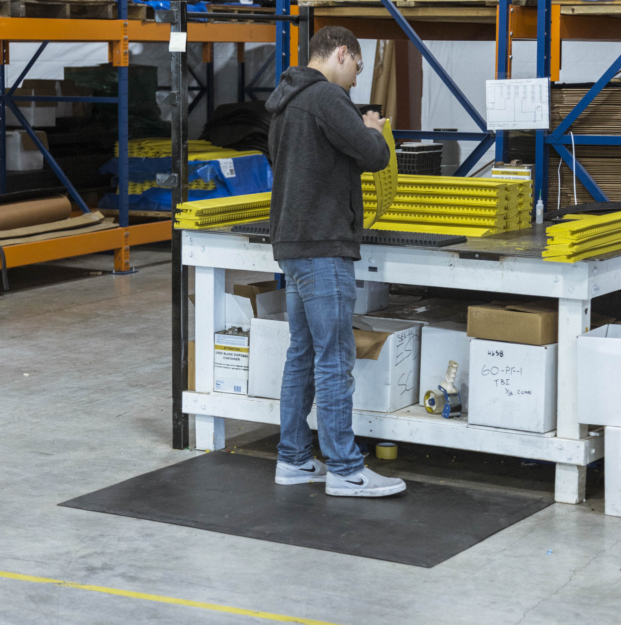 Older worker sitting in manufacturing environment